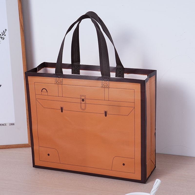 Bolsas de tela no tejida de película de mano de ropa unisex bolsas de regalo impermeables logotipo personalizado