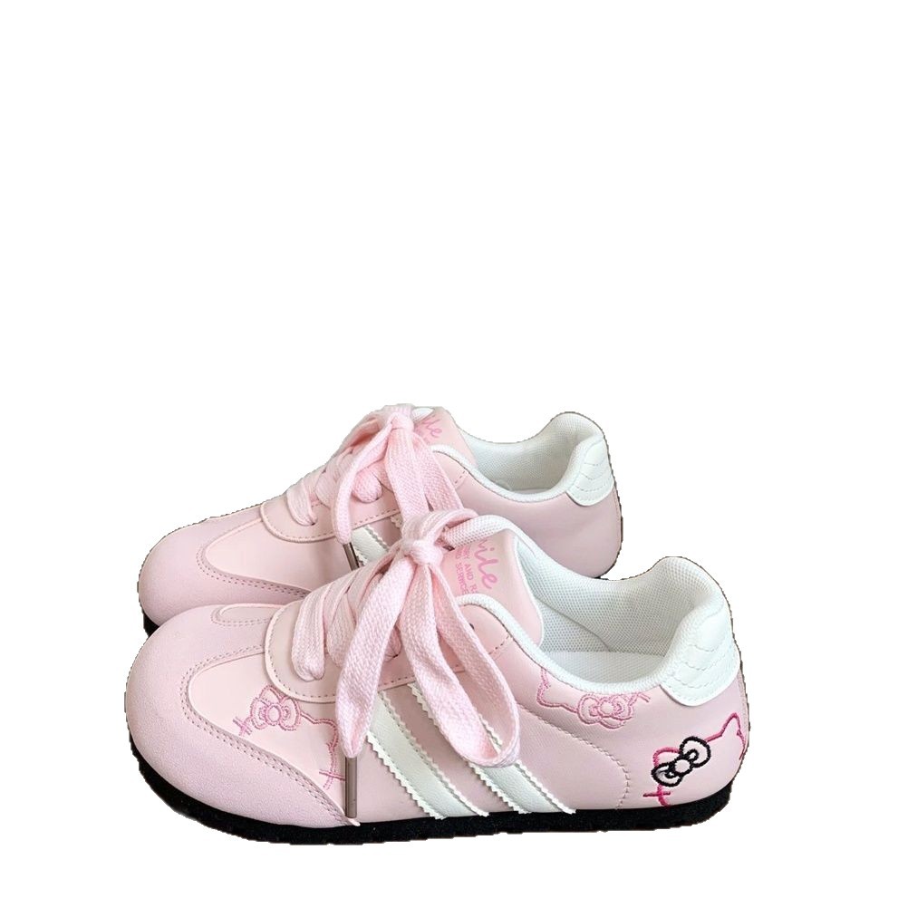 Hermosos KT bordados zapatos blancos para mujeres 2025 verano y otoño nuevos zapatos de entrenamiento alemán plano de moda universal zapatos de skate casuales
