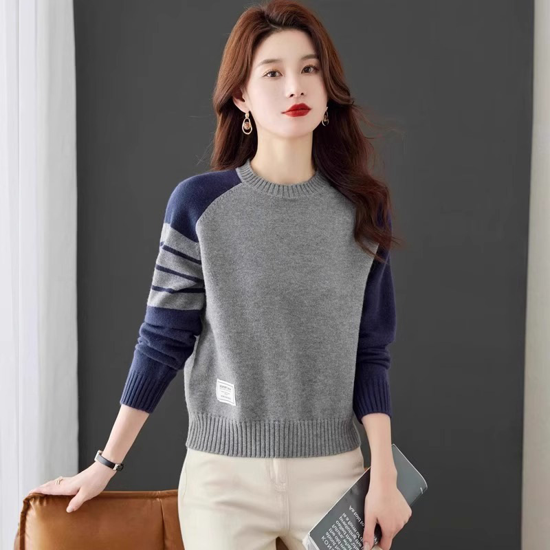 Short demi-season knitted base body-friendly sweater with a round…