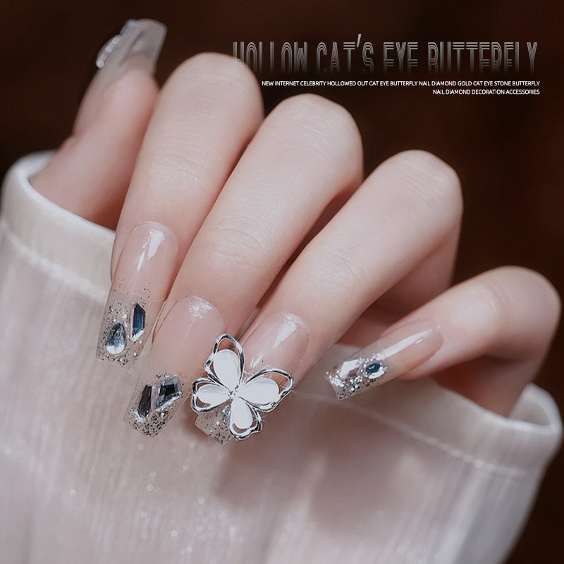 Uñas de cristal gato ojo mariposa aleación joyería en línea celebridad uñas hueco mariposa desgaste accesorios de uñas al por mayor