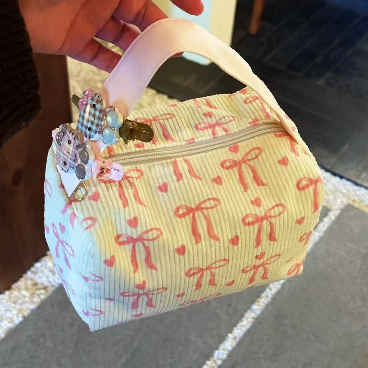 Fuchsia cosmetic bag with bow