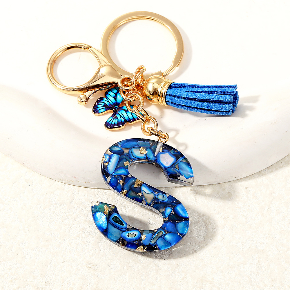 Nuevo transfronterizo mariposa 26 letras inglesas de cristal goteo llavero bolsos accesorios colgante de automóviles