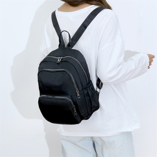 Casual minimalist daily travel backpack for women, lightweight and easy to carry, large capacity fashionable mom bag, waterproof nylon fabric bag
