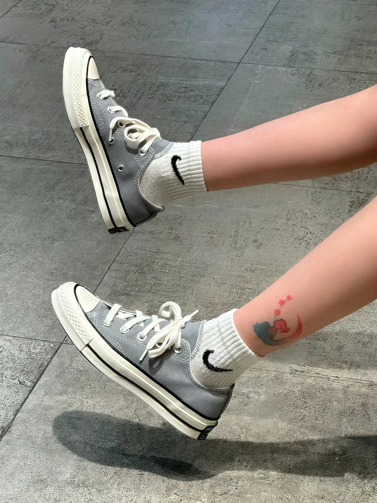 Dark gray low top. recommend sizing up