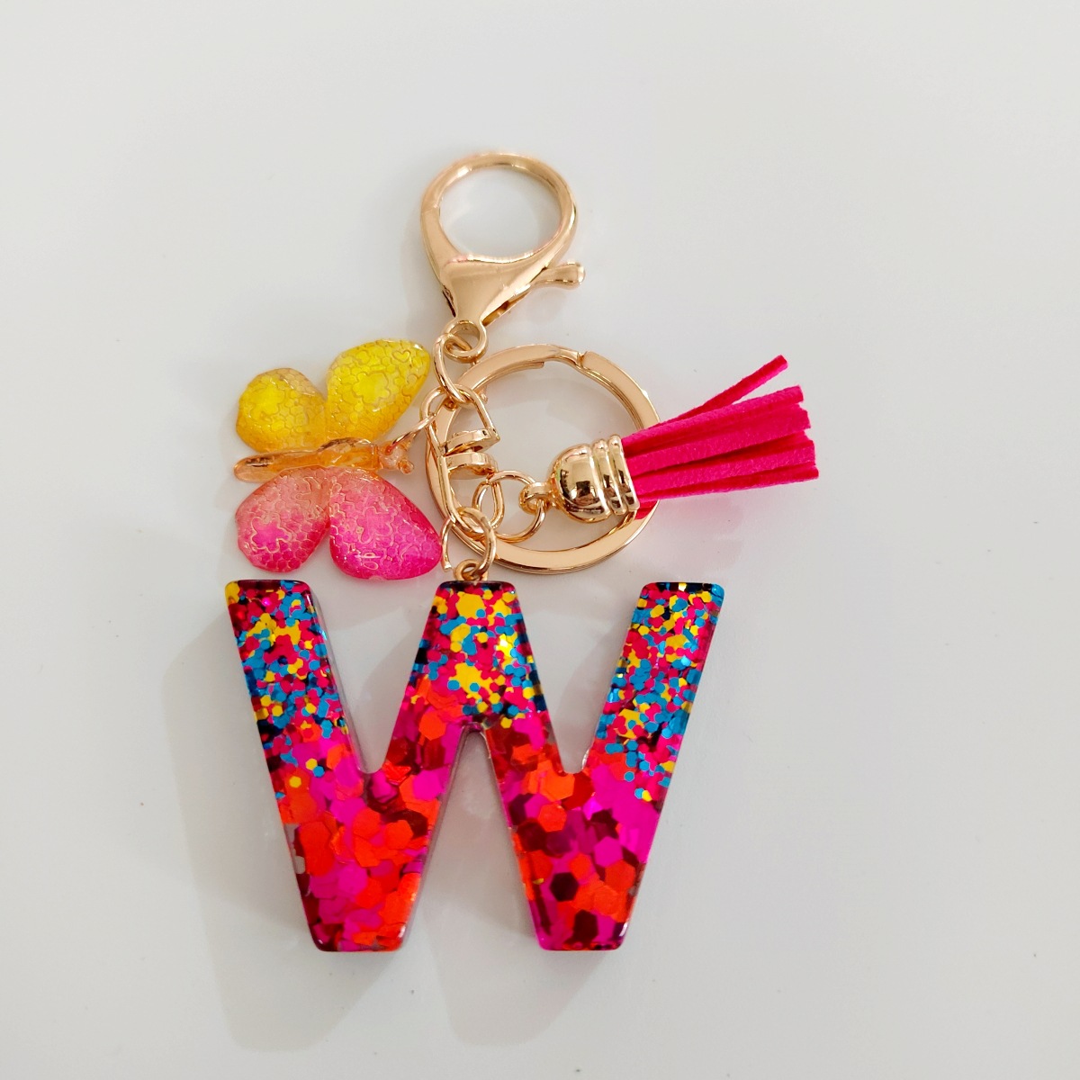 Ventas transfronterizas calientes de letras inglesas de color mixto colgante de llavero colgante de mariposa fringe de resina de llavero colgante de joyería