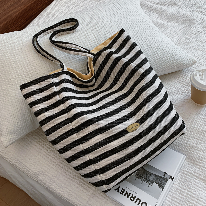Bolsas de lona a rayas de doble cara nicho de mujeres coreanas de gran capacidad perezosa bolsas de compras de ocio de estudiantes