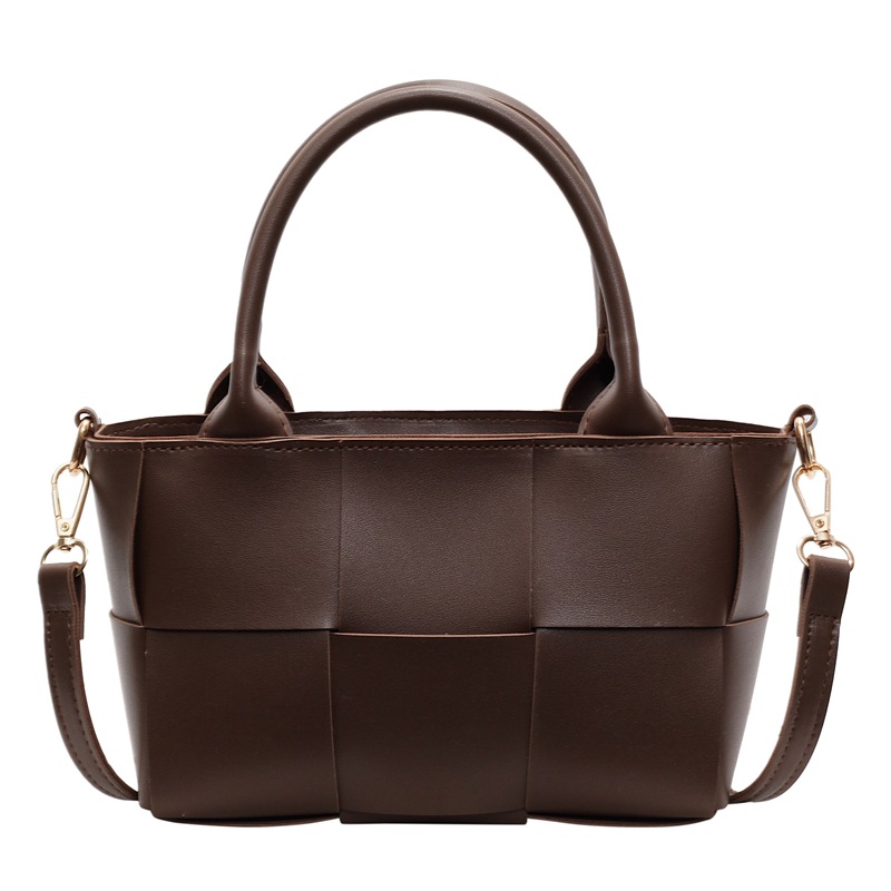 Diseño coreano de nicho de alta sensación portátil bolso de cubo de moda para mujeres 2024 nuevo tejido retro hombro mochila