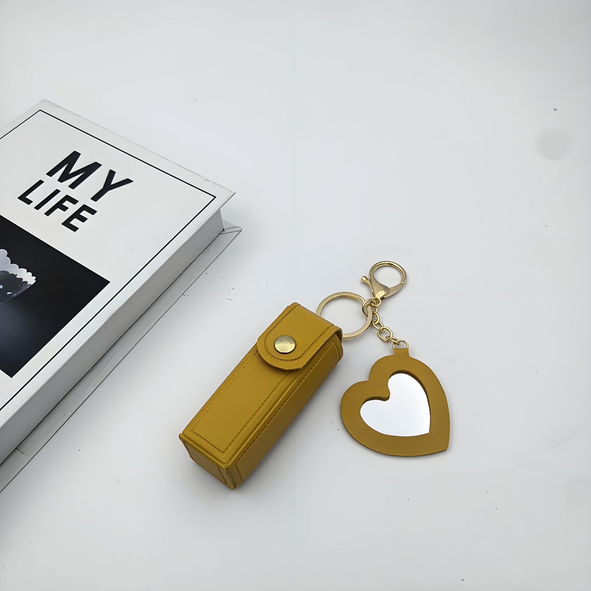 Bolso de cambio transfronterizo sobre rojo espejo creativo llavero colgante pequeño PU cuero bolso de coche accesorios accesorios en stock