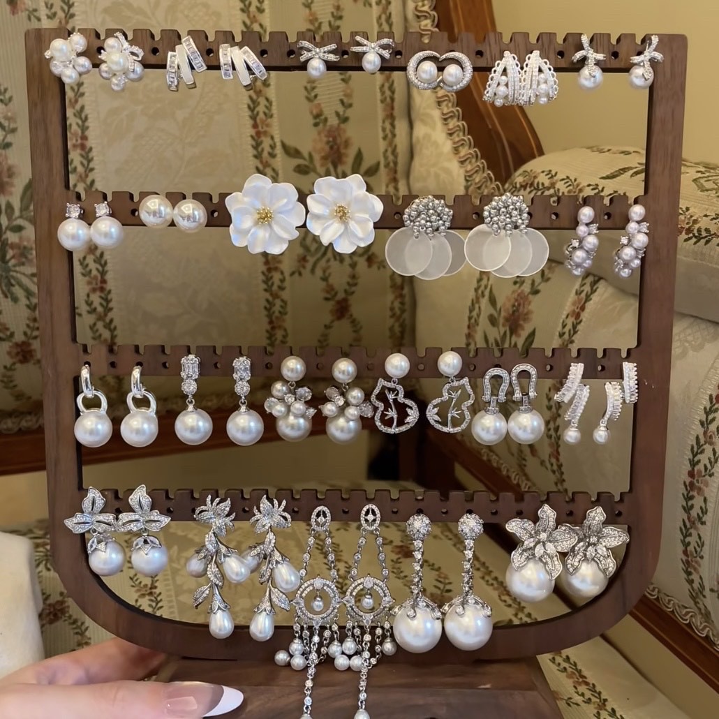 Sophisticated elegant fashionable earrings with zircon from pearl