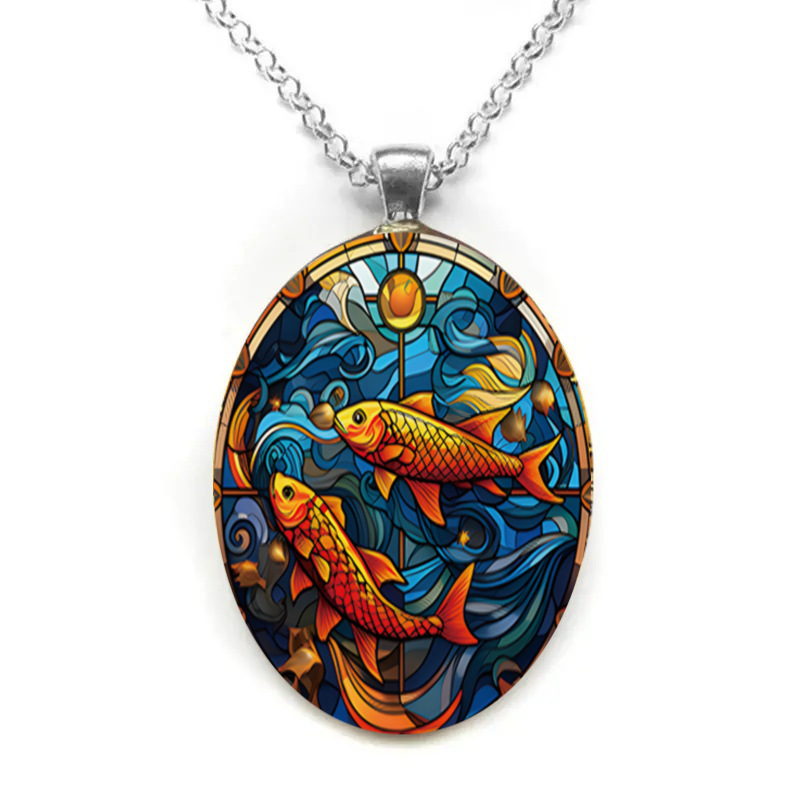 Oval glass pendant necklace with lively fish patterns in the water