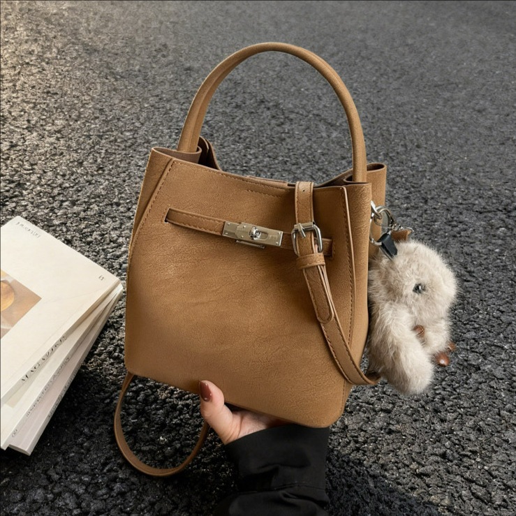 Transfronterizos otoño invierno hija bolsa retro versátil bolso de cubo portátil 2025 nuevo estilo de alta calidad sensación de hombro mochila moda