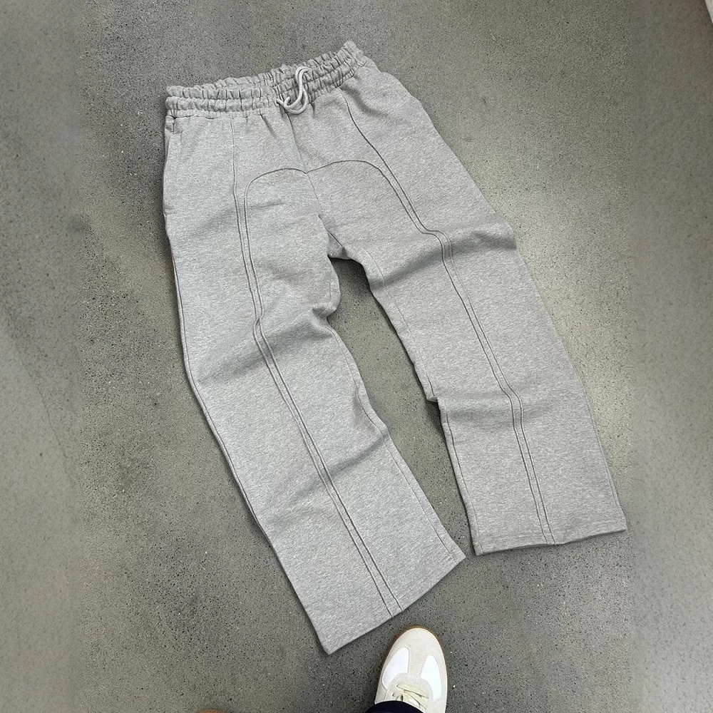 Spot 2025 marca de moda ins pantalones de pierna ancha de nicho de color sólido deportes sueltos hombres y mujeres pantalones de protección de todo fósforo de moda al por mayor
