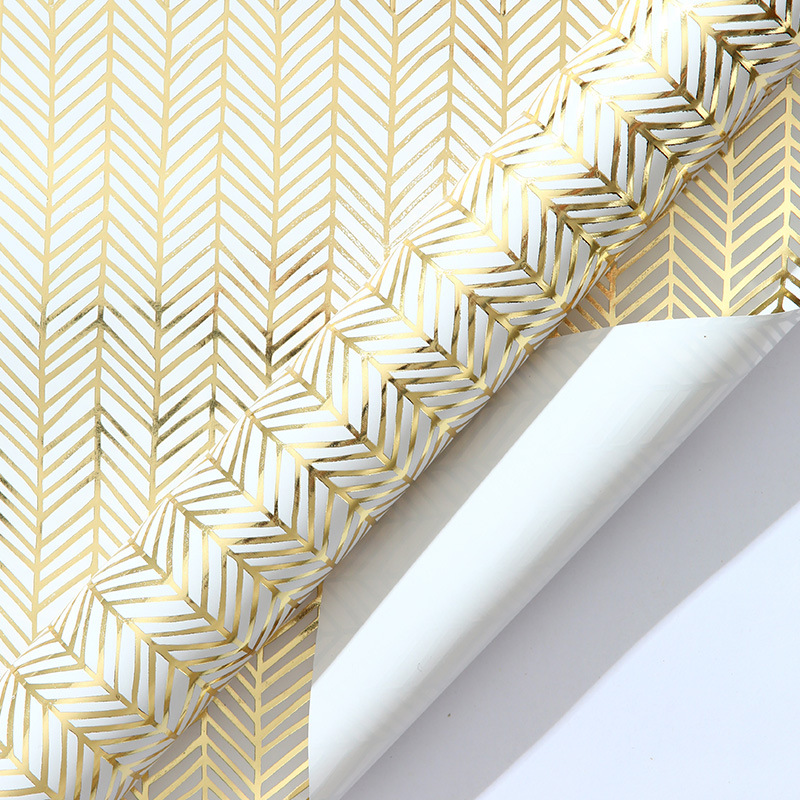 Amazon venta caliente de papel de gran tamaño de papel de papel de bronce estampado dorado ondulado punto inclinado banda de regalo papel de embalaje mayorista