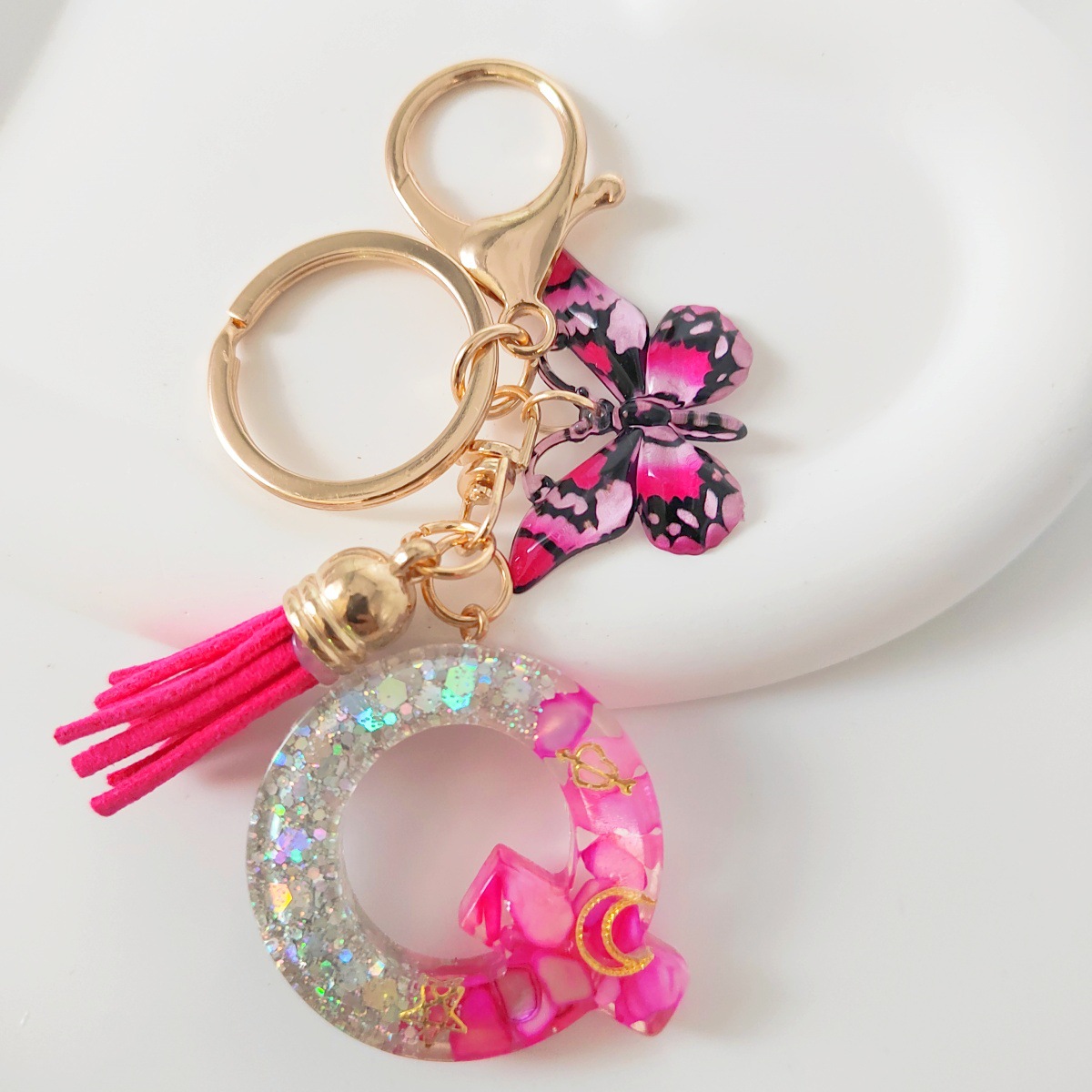 Inventario transfronterizo nueva resina bicolor mariposa borda llavero colgante estrella luna accesorios de joyas