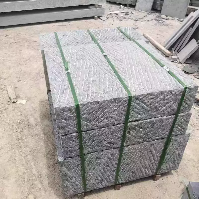 Hand-cut bluestone construction project paving roadside stone square scene area chisel road surface stone bluestone