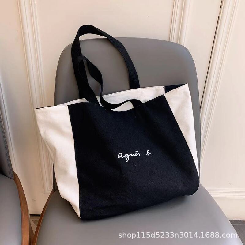 Large capacity outdoor leisure travel daily matching portable one-shoulder black and white two-side canvas shopping bag tote bag