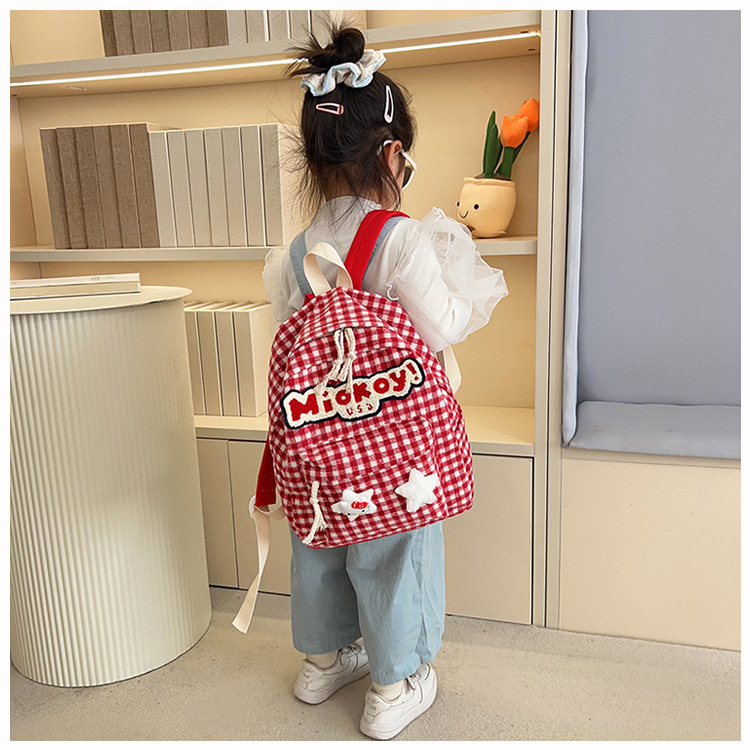 The large-capacity red woolen checkered backpack for primary and secondary school students is a unique and versatile choice. It's a trend for girls to carry backpacks during their leisure trips undefined