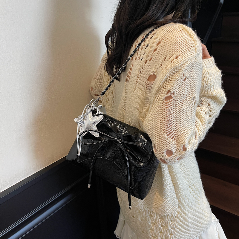 Versión coreana del bolso de cadena de nicho 2025 verano nuevo bolso femenino moda bowknot bandolera de textura de alta calidad