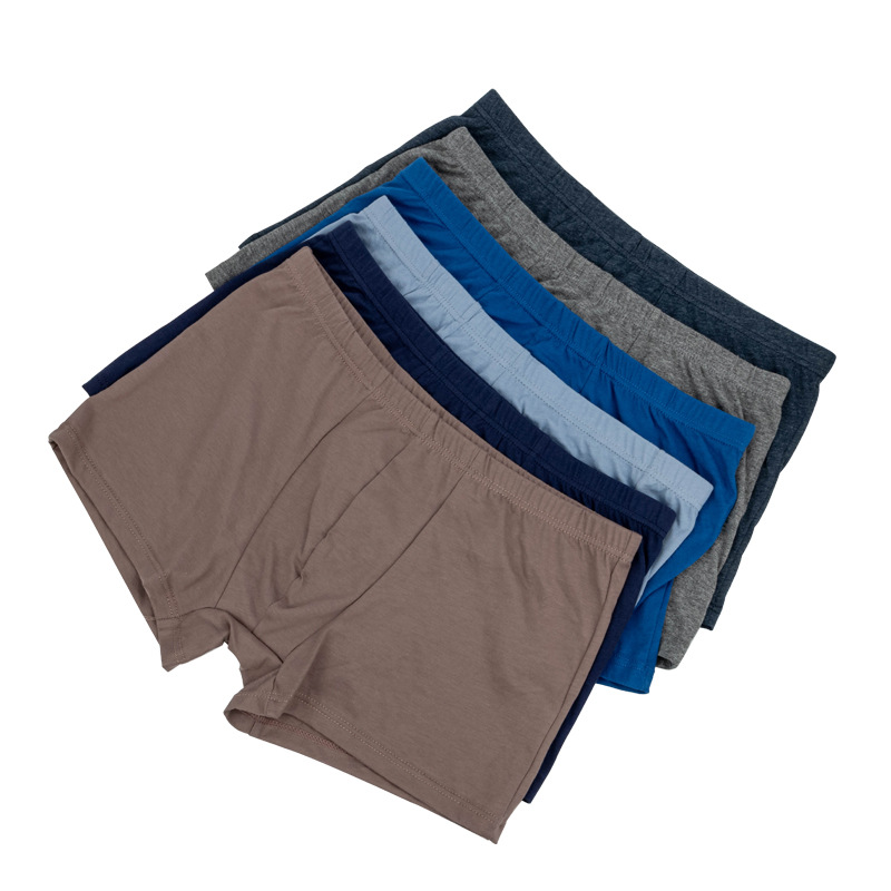 Fabricantes de pantalones interiores de color sólido de hombre, pantalones interiores de hombre transpirables, una al por mayor de pantalones interiores de ángulo plano de hombre