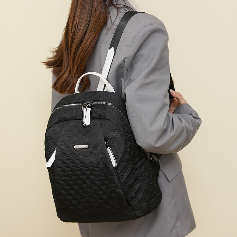 2024 otoño nuevo estilo casual todo fósforo damas mochila de nailon moda color de contraste ligero mochila de viaje de viaje