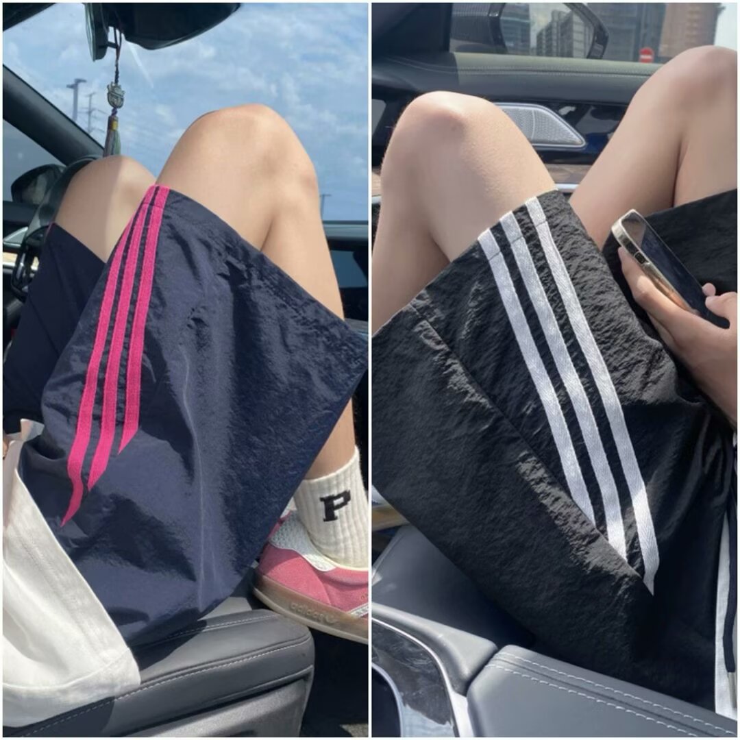 Pantalones cortos para hombres verano 2026 nueva tendencia americana de tres barras pantalones deportivos juveniles casuales sueltos versátiles pantalones