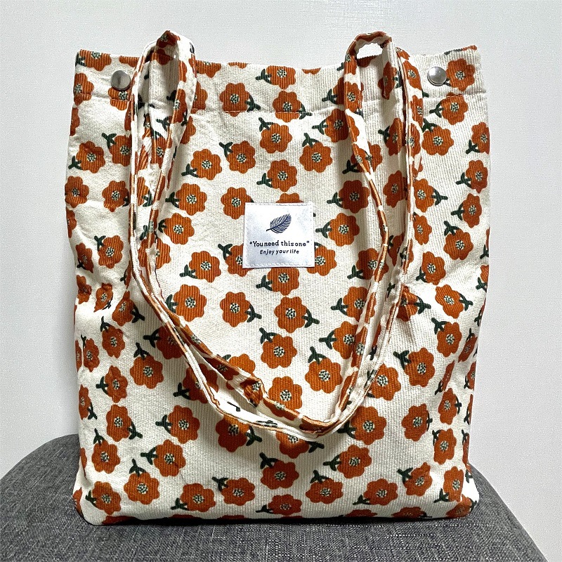 Versión coreana del bolso de lona de pana, bolso de almacenamiento portátil, bolso femenino, bolso de hombro de todo fósforo literario de gran capacidad, spot femenino al por mayor