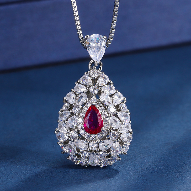 Zhuang Sheng joyería nueva TikTok Venta caliente joyería de moda traje de simulación corindón rojo anillo colgante piedra principal 4*6