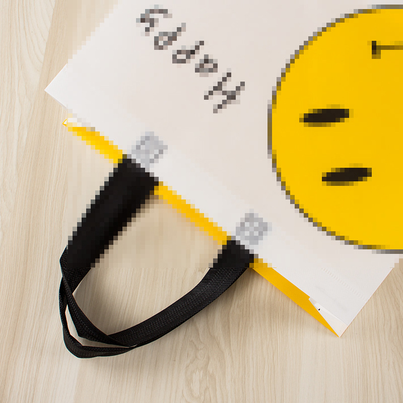 Nueva tela no tejida recubierta engrosada linda cara sonriente amarilla ropa de mujer para niños compras portátiles tienda de ropa Orden de bolsa