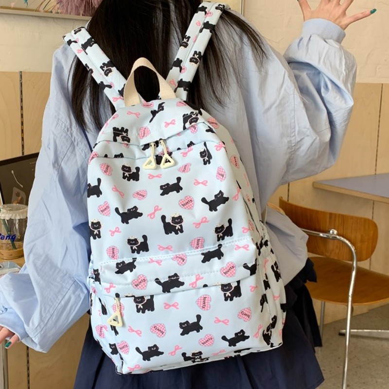 2025 nueva mochila caricatura encantadora impresión mochila de estudiantes de primaria y secundaria mochila de viaje ligera de gran capacidad