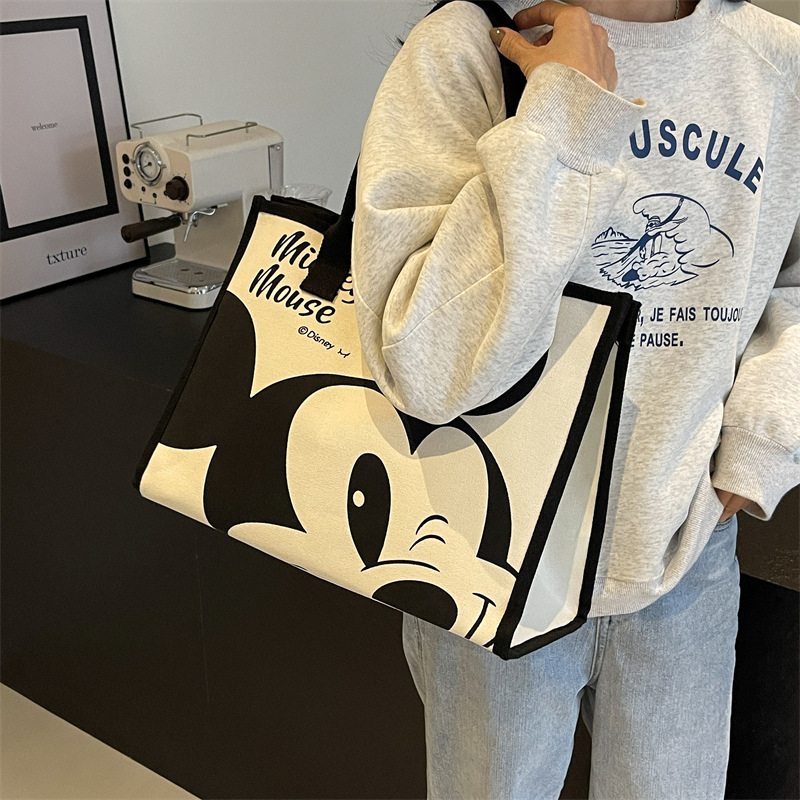 2024 bolsa de lona de las mujeres de primavera nueva moda bolsa de hombro de gran capacidad bolsa de viaje portátil de dibujos animados bolso de la momia