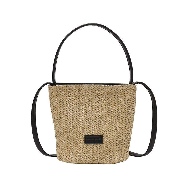 Bolso de cubo de vacaciones junto al mar 2025 nuevo bolso de mujer bolso de hombro tejido de paja de playa bolso de mensajero de color de contraste a rayas
