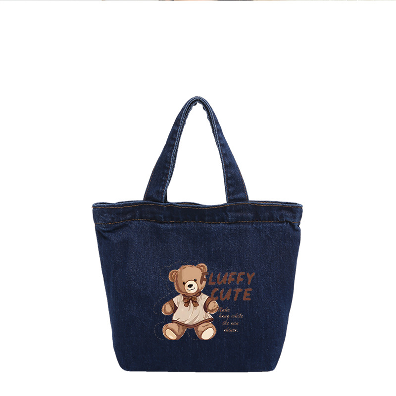 Los fabricantes venden bolsos de peluche de oso al por mayor, bolsos de muñecas de dibujos animados portátiles de gran capacidad, bolsos de moda y lindos.