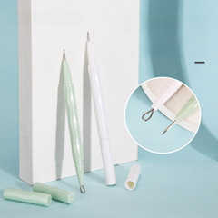 Stainless steel double-ended blackhead extractor set with a closed comedone pen case, pointed blackhead needle, and beauty needle with a cap