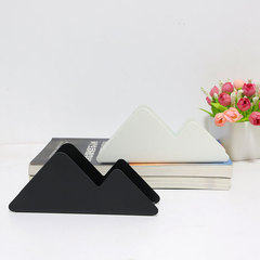 Nordic-inspired black vertical tissue holder for hotels, restaurants, and cafes, mountain-shaped tissue stand, cream-colored tissue clip