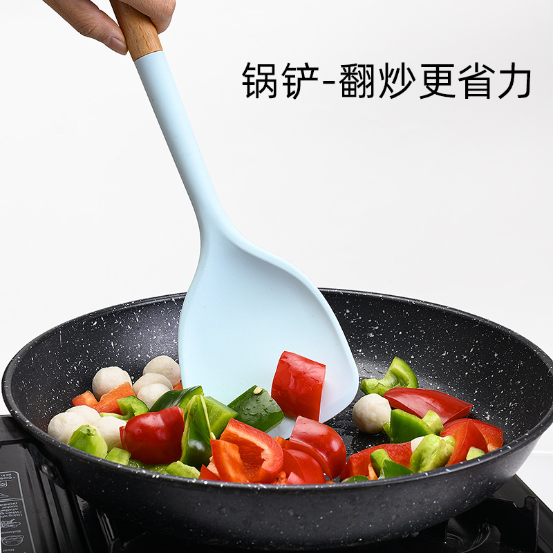 Suministros de cocina cara sonriente mango de madera de estilo europeo sartén antiadherente espátula de silicona conjunto de 10 piezas azul traje de utensilios de cocina resistente a altas temperaturas