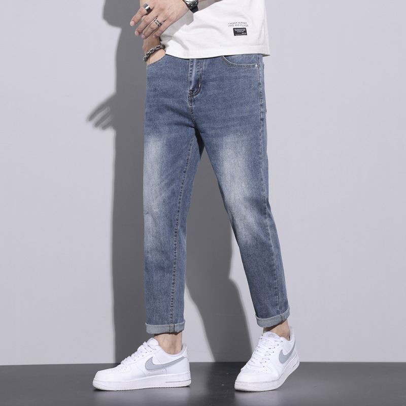 Pantalones vaqueros blancos lavados vintage de la estación europea de los hombres nuevos pantalones largos de los hombres elásticos flojos de moda del todo-fósforo