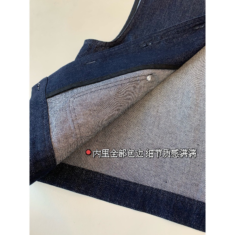 时髦叠搭棉质牛仔料水洗工艺宽松版单排多扣银色铆钉扣牛仔马甲女|undefined