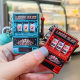 Creative playable retro rocker fruit machine lottery machine turnaround game keychain pendant simulation toys wholesale