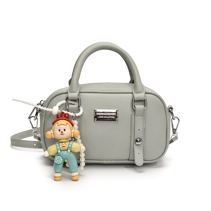 Bolso de bolera de mano de estilo explosivo para mujer 2025 nuevo bolso de hombro de estilo occidental de todo fósforo bolso de mensajero de paso de moda de alta gama