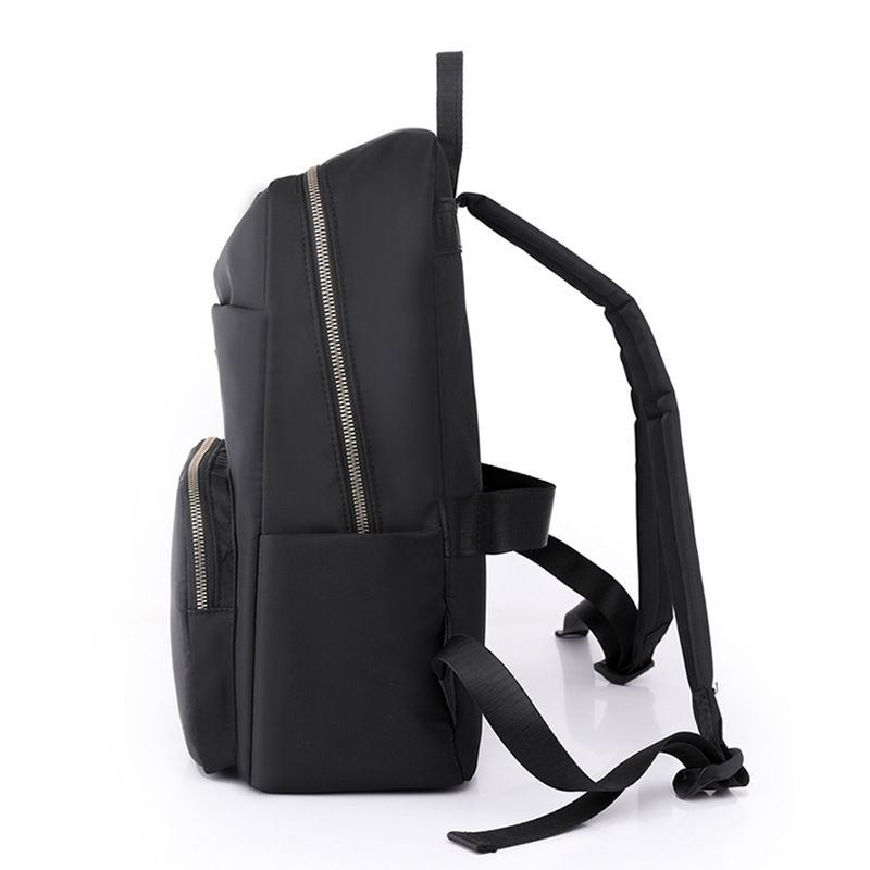 Comercio exterior al por mayor 2023 verano nuevo estilo versión coreana de las señoras mochila de nailon mochila simple de color sólido de gran capacidad para estudiantes