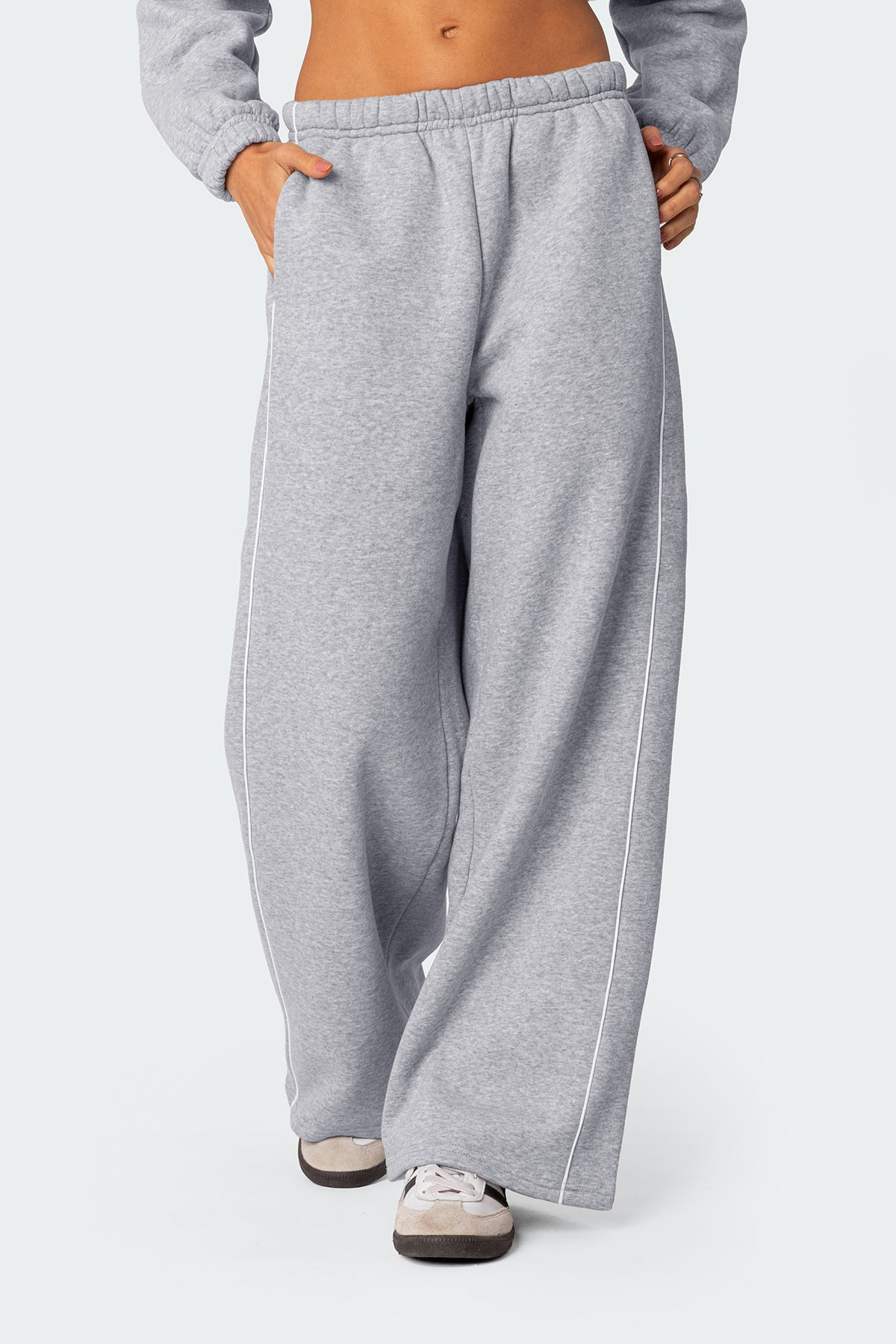 Europa y los Estados Unidos transfronterizos otoño y invierno personalidad callejera mujer blanco contraste rayas laterales casuales cintura elástica pantalones deportivos rectos