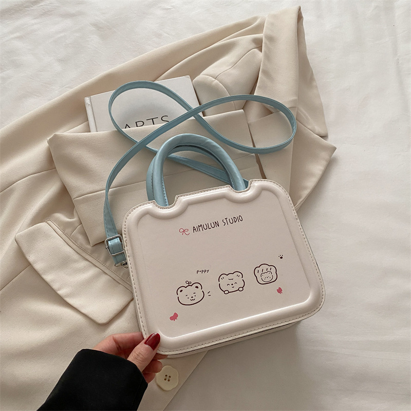 Bolso pequeño de nicho femenino 2025 primavera y verano nuevo estilo bolso bandolera de textura blanca con sentido de diseño bolso de galleta portátil pequeño bolso cuadrado