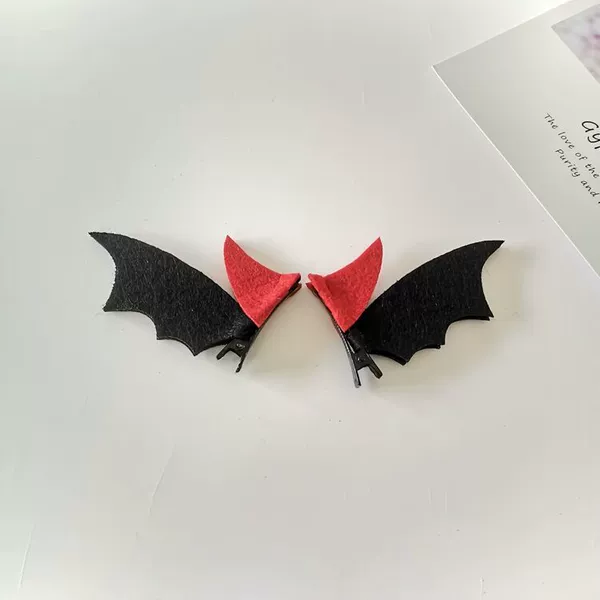 A pair of red horn and black wing hairpins