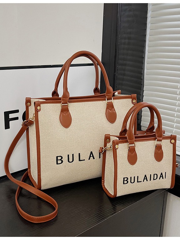 Bolsos para mujer 2026, nuevo estilo de moda, bolso tote de lona con logo bordado, bolso de mano de alta gama, bolso bandolera para el día a día