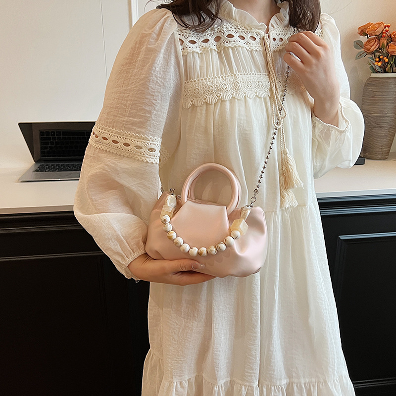 High end handbag for women in 2024, new niche design, summer handheld pleated chain strap, crossbody cloud bag_voghion.com