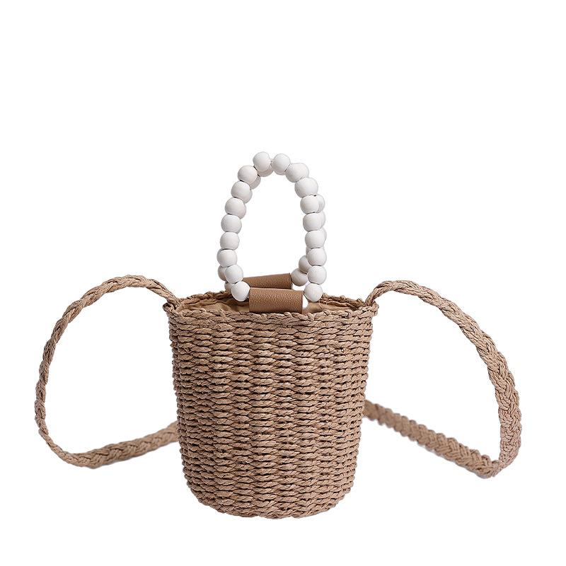 Bolso de cubo de vacaciones junto al mar 2025 nuevo bolso de mujer bolso de hombro de playa tejido de paja mini bolso de mensajero con cuentas