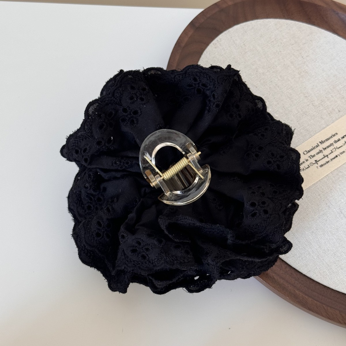 Black crab pin, floral print, lace dress