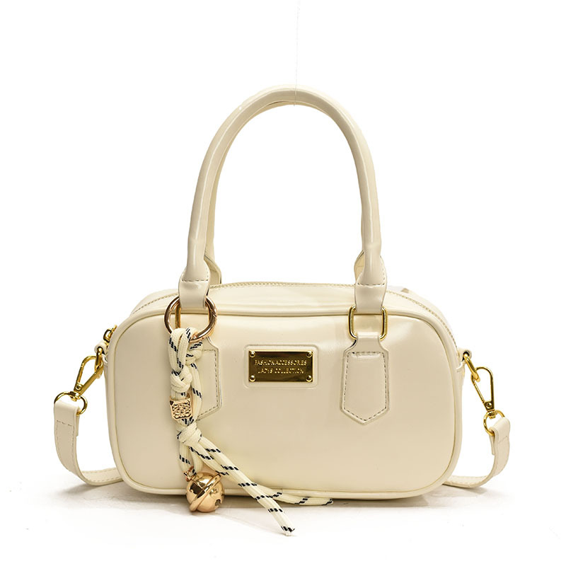 Bolsa de bolos de mano caliente para mujeres 2025, nueva bolsa de hombro simple de moda popular, bolso de mochila de estilo extranjero