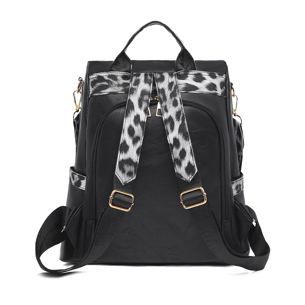 Fabricantes al por mayor 2025 nueva mochila de cuero suave para damas retro europeas y americanas moda estampado de leopardo contraste color bolso de mochila antirrobo