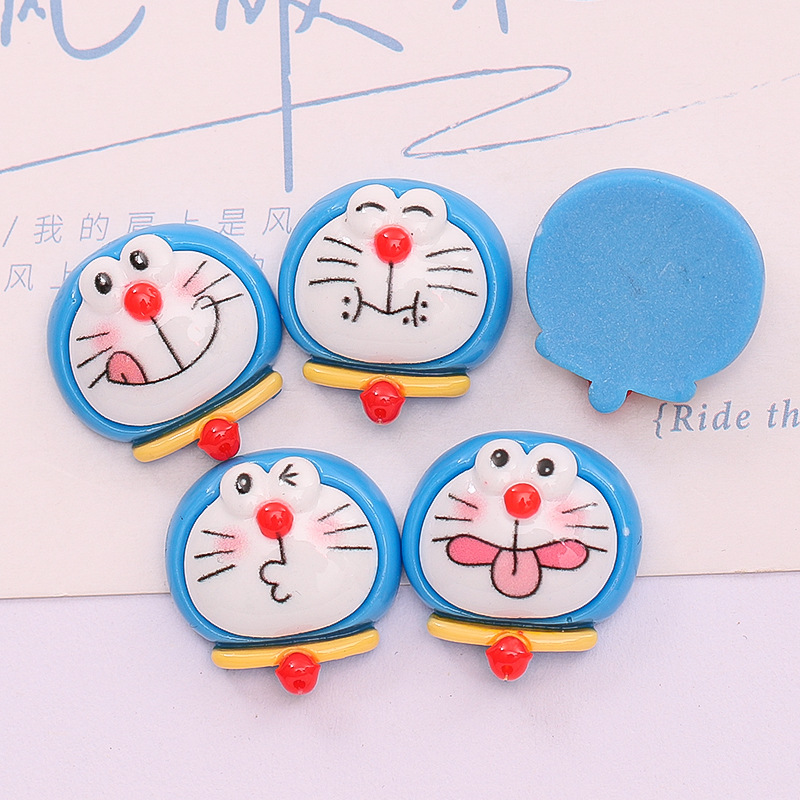 Dibujos animados lindo Jingdang gato expresión DIY caja del teléfono accesorios para el cabello crema pegamento material hecho a mano accesorios de resina al por mayor